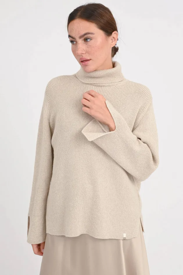 Rollkragenpullover mit Glitzereffekt in Beige